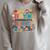 Everyone Communicates Differently Book Kids Teacher Raglan Sleeve Sweatshirt Heather Forest