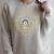 Frankenstein Book Victorian Badge Logo Raglan Sleeve Sweatshirt Heather Forest Frankenstein Book Victorian Badge Logo Raglan Sleeve Sweatshirt Heather Forest