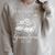 Grandma Est 2027 Best Chapter Yet Floral Book Raglan Sleeve Sweatshirt Heather Forest