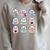 Halloween Ghosts Reading Books Pattern Spooky Kawaii Anime Raglan Sleeve Sweatshirt Heather Forest