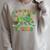 It's Good Luck To Read St Patrick's Day Book Lucky Raglan Sleeve Sweatshirt Heather Forest