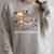 Just One More Chapter Bookish Raccoon Reading Book Reader Raglan Sleeve Sweatshirt Heather Forest