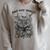 Just One More Chapter Vintage Floral Skeleton Reading Book Raglan Sleeve Sweatshirt Heather Forest