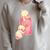 Kewpie Baby Magic Spell Book Witchcraft Halloween Gothic Raglan Sleeve Sweatshirt Heather Forest