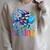 Kids Be Kind Rainbow Scale Fish Teacher Reading Book Toddler Raglan Sleeve Sweatshirt Heather Forest Kids Be Kind Rainbow Scale Fish Teacher Reading Book Toddler Raglan Sleeve Sweatshirt Heather Forest