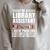 Library Assistant Books Librarian Associate Curator Keeper Raglan Sleeve Sweatshirt Heather Forest