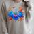 Little Ghost Coffee Tee Spooky Season Ghost Reading Book Raglan Sleeve Sweatshirt Heather Forest