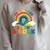 Take a Look It's In a Book Rainbow Reading Raglan Sleeve Sweatshirt Heather Forest
