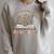A New Chapter Begins Retirement Floral Book Retired 2026 Raglan Sleeve Sweatshirt Heather Forest