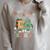 Oh What Fun It Is To Read Christmas Tree Book Lover Groovy Raglan Sleeve Sweatshirt Heather Forest