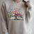 Open Book With Wildflowers Blooming Around Pages Raglan Sleeve Sweatshirt Heather Forest