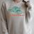 The Plot Thickens Bookish Raccoon Fantasy Book Reader Raglan Sleeve Sweatshirt Heather Forest The Plot Thickens Bookish Raccoon Fantasy Book Reader Raglan Sleeve Sweatshirt Heather Forest