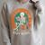 Read Books Be Kind Stay Weird Skeleton Reading Goth Bookish Premium Raglan Sleeve Sweatshirt Heather Forest