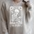 The Reader Tarot Card Book Lover Skeleton Reading Book Raglan Sleeve Sweatshirt Heather Forest