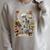 The Reader Tarot Card Skeleton Reading Book Raglan Sleeve Sweatshirt Heather Forest