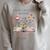 Retired 2026 Teacher Women A New Chapter Begins Floral Book Raglan Sleeve Sweatshirt Heather Forest Retired 2026 Teacher Women A New Chapter Begins Floral Book Raglan Sleeve Sweatshirt Heather Forest