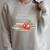 Retired But Forever A Teacher At Heart Vintage Books & Apple Raglan Sleeve Sweatshirt Heather Forest
