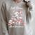 Skeleton Costume Woman Pajama Book Reading Dark Romance Premium Tri-Blend Raglan Sleeve Sweatshirt Heather Forest
