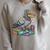 Smart Pigeon Sitting On Book Stack Raglan Sleeve Sweatshirt Heather Forest Smart Pigeon Sitting On Book Stack Raglan Sleeve Sweatshirt Heather Forest