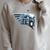 Star Wars The Book Of Boba Fett Chrome Helmet Logo Raglan Sleeve Sweatshirt Heather Forest
