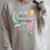 Unearth a Story Dinosaur Book 2026 Summer Reading Program Raglan Sleeve Sweatshirt Heather Forest Unearth a Story Dinosaur Book 2026 Summer Reading Program Raglan Sleeve Sweatshirt Heather Forest
