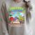 Unearth A Story Dinosaur Books Summer Reading 2026 Raglan Sleeve Sweatshirt Heather Forest