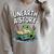 Unearth a Story Frog Reading a Book Summer 2026 Raglan Sleeve Sweatshirt Heather Forest