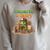 Unearth a Story Summer 2026 Dinosaur Reading Books Dino Raglan Sleeve Sweatshirt Heather Forest
