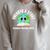 Unearth a Story Summer 2026 Reading Program Earth Read Book Premium Tri-Blend Raglan Sleeve Sweatshirt Heather Forest