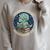 Unearth A Story Summer Reading 2026 Cute Dinosaur Reading Raglan Sleeve Sweatshirt Heather Forest Unearth A Story Summer Reading 2026 Cute Dinosaur Reading Raglan Sleeve Sweatshirt Heather Forest