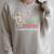Unearth a Story Summer Reading 2026 Dandelion Books Readers Premium Tri-Blend Raglan Sleeve Sweatshirt Heather Forest