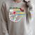 Unearth a Story T-Rex Reading a Book Summer Reading 2026 Raglan Sleeve Sweatshirt Heather Forest Unearth a Story T-Rex Reading a Book Summer Reading 2026 Raglan Sleeve Sweatshirt Heather Forest