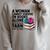 A Woman Cannot Survive On Books Alone She Also Needs Yarn Raglan Sleeve Sweatshirt Heather Forest A Woman Cannot Survive On Books Alone She Also Needs Yarn Raglan Sleeve Sweatshirt Heather Forest