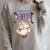 Women's Dungeon Crawler Carl Airbrushed Princess Donut Series Book Raglan Sleeve Sweatshirt Heather Forest
