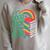 Women's Its Good Luck To Read Rainbow Reading Books Raglan Sleeve Sweatshirt Heather Forest