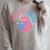 Women's Space CAT Reader Pink Helmet Blue Book Nerd Galaxy Kitty Raglan Sleeve Sweatshirt Heather Forest