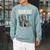 Football Skeleton Reading On Book Stack Raglan Sleeve Sweatshirt Cardinal