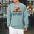 Unearth A Story Dinosaur Reader Book Lover 2026 Raglan Sleeve Sweatshirt Cardinal