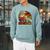 Unearth a Story Dinosaur Reading Book Dino T Rex Summer 2026 Raglan Sleeve Sweatshirt Cardinal