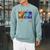 Women's Summer Reading 2026 Unearth A Story Dinosaur Books Raglan Sleeve Sweatshirt Cardinal