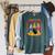 Caring For Your Evil Cat Retro Dark Humor Book Cover Raglan Sleeve Sweatshirt Heather Blue Lagoon Caring For Your Evil Cat Retro Dark Humor Book Cover Raglan Sleeve Sweatshirt Heather Blue Lagoon