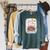 Unearth A Story Reading Book Flowers Summer Reading 2026 Raglan Sleeve Sweatshirt Heather Blue Lagoon Unearth A Story Reading Book Flowers Summer Reading 2026 Raglan Sleeve Sweatshirt Heather Blue Lagoon