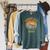 Vintage January 1972 Dark Academia Skull On Books Distressed Raglan Sleeve Sweatshirt Heather Blue Lagoon