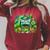 Unearth a Story Library Summer Reading 2026 Dinosaur Book Raglan Sleeve Sweatshirt Heather Dust