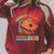 Unearth A Story Summer Reading 2026 Dinosaur Book Lover Dino Premium Tri-Blend Raglan Sleeve Sweatshirt Heather Dust