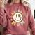 Happy Baseball Mom Groovy Retro Floral Smiling Face Comfort Colors Sweatshirt Orchid