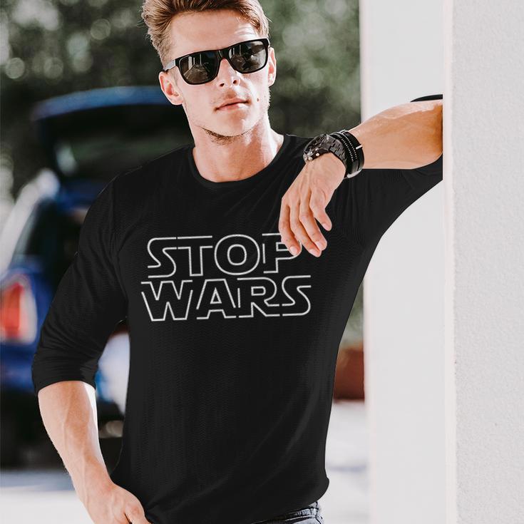 ストップウォーズティー反戦活動家ストップウォーズピースセーフワールド 長袖Tシャツ 彼への贈り物