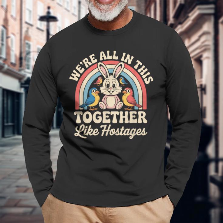We're All In This Together Like Hostages 長袖Tシャツ 高齢者への贈り物