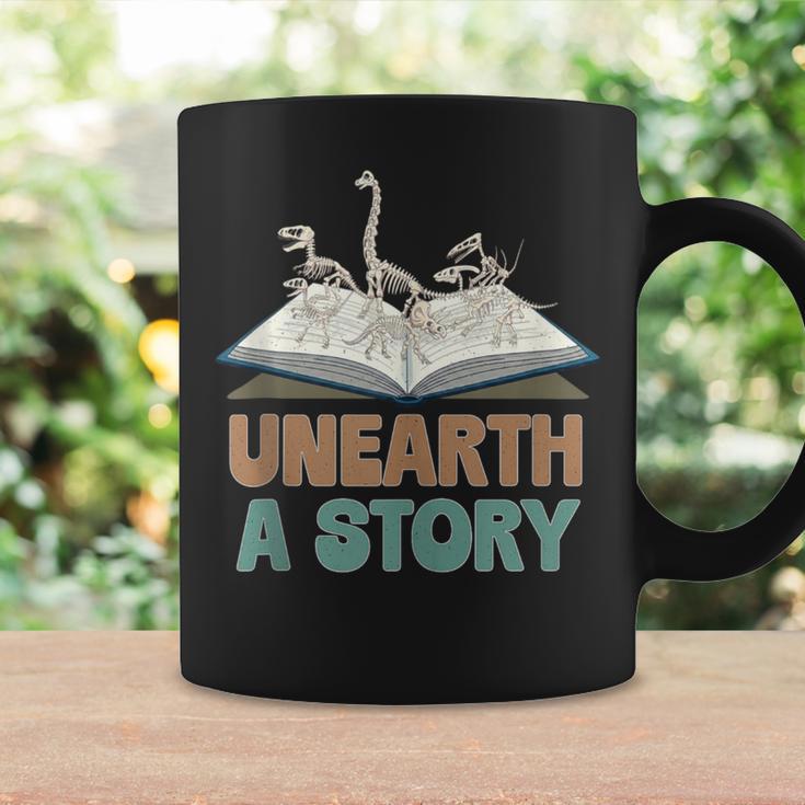Unearth A Story Skeleton Dinosaur Book Summer Reading 2026 Graphic Print Coffee Mug Gifts ideas Unearth A Story Skeleton Dinosaur Book Summer Reading 2026 Graphic Print Coffee Mug Gifts ideas