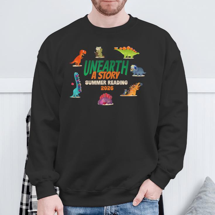 Summer Reading 2026 Unearth A Story Dinosaurs Book Lover Sweatshirt Gifts for Old Men Summer Reading 2026 Unearth A Story Dinosaurs Book Lover Sweatshirt Gifts for Old Men